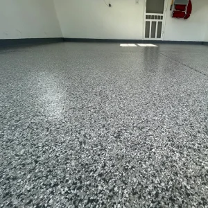 Close-up of garage floor with Meteor flake color from Galaxy Concrete.