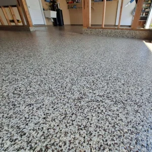 Close-up of garage with Asteroid flake color from Galaxy Concrete.