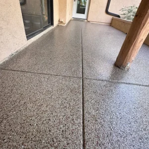 Close-up of patio floor with Mercury flake color from Galaxy Concrete.