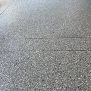 Close-up of patio floor with Milky Way flake color from Galaxy Concrete.